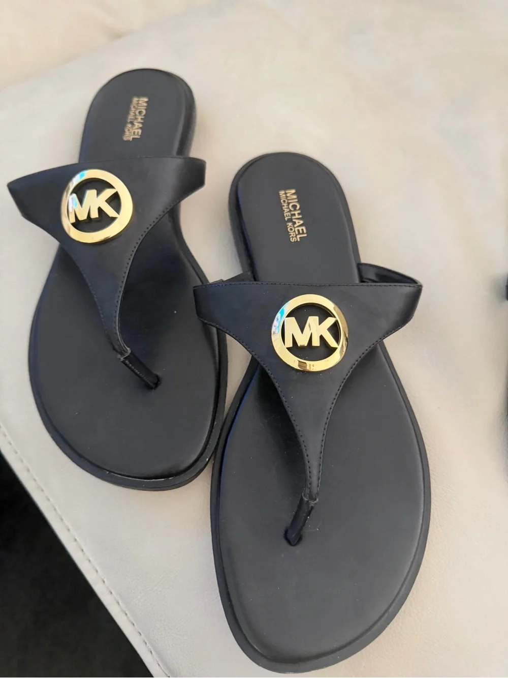 Michael Kors Black Thong Sandals with Gold MK Emblem